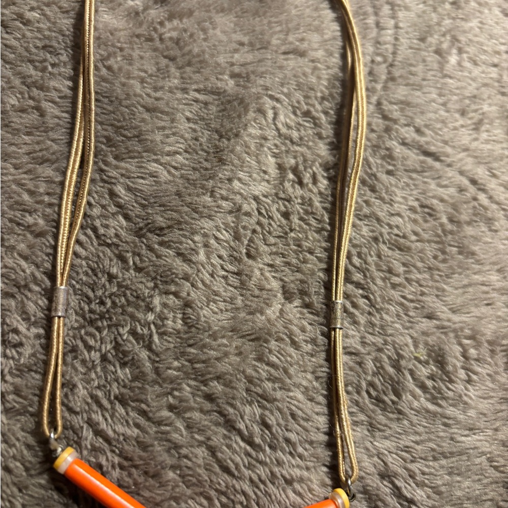 Orange and Gold Necklace rolled cylinder and ring circles .